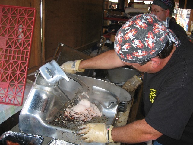 Lt. Kevin Shiloh slicing carnival pit beef